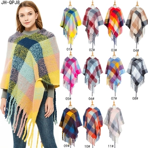 Women's plaid tassel poncho with colorful check pattern and thick knit fringe detail