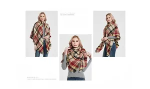 Macro detail of classic red plaid scarf with tassel edges and soft cashmere-like texture