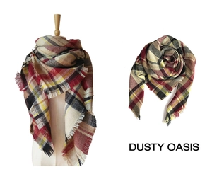 Detail of red and yellow plaid scarf featuring fine tassels and soft knitted texture