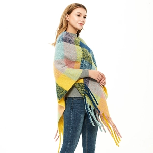 Women's colorful plaid poncho shawl with long tassels and chunky knit texture