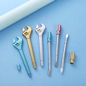Detailed close-up of plastic wrench and screwdriver shaped pens in metallic finish colors