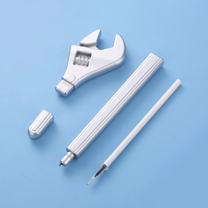 Detail view of disassembled silver wrench-shaped creative ballpoint pen parts