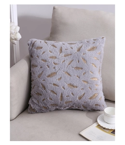 Detail of plush grey velvet pillow cover with luxury gold feather foil printing patterns