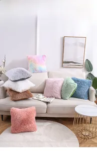 Macro view showing the soft long plush texture and vibrant colors of the throw pillows