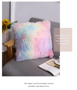 Detail of soft rainbow faux fur pillow cover with durable hidden zipper on gray sofa