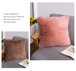 Detailed close-up of soft plush shaggy throw pillow fabric in coral pink and light brown
