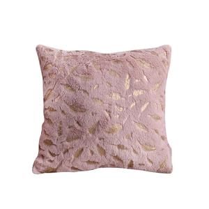 Pink plush throw pillow cover with golden feather patterns on a soft faux fur fabric