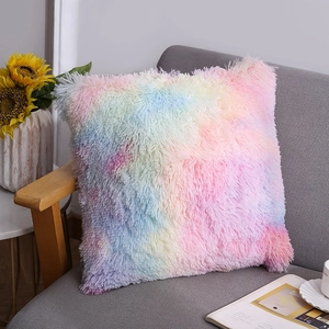 Plush rainbow gradient square pillowcase on a sofa in a cozy home setting