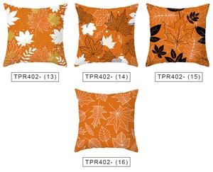 Detail view of four orange maple leaf pillow covers with different fall pattern designs