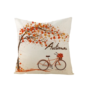 Autumn themed pillow cover with orange maple tree and vintage bicycle design on beige fabric