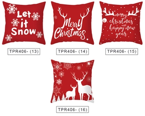 Detail view of four Christmas pillow covers with white reindeer and snowflake prints