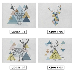 Detail of four linen placemats with abstract geometric reindeer designs and textures