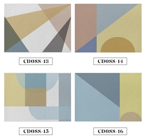 Detail of four linen placemats with abstract geometric patterns in earthy neutral tones