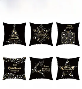 Detailed view of 6 black and gold Christmas pillow covers with festive tree and reindeer motifs