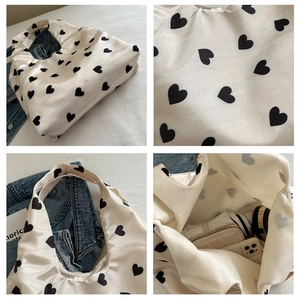 Detail shots of white heart pattern tote bag showing fabric texture and large capacity