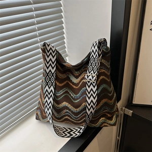 Ethnic knit tote bag with brown wave pattern and geometric diamond pattern shoulder strap