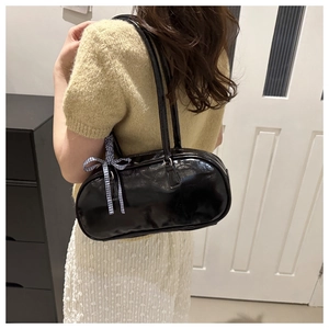 Glossy black PU leather boston bag with a blue and white checkered ribbon detail