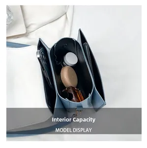 Internal capacity of contrast crossbody bag with three compartments for daily items