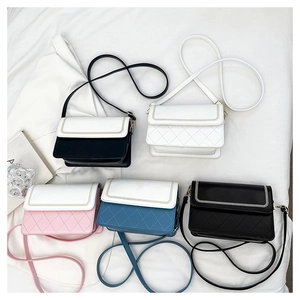 Detail view of quilted crossbody bags in five colors with metallic chain edge trim