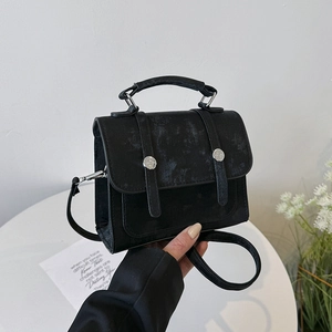 Minimalist black messenger bag with vintage matte texture and top handle for women