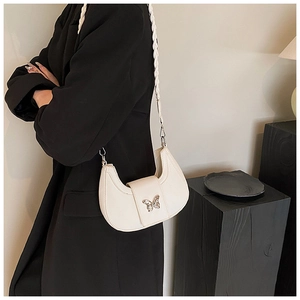 French style white half-moon underarm bag with silver butterfly and woven strap detail