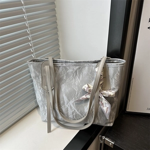 Gray textured tote bag with fashion printed scarf on handle, modern urban style for work