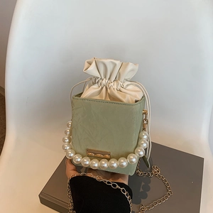 Light green box bag with pearl handle and golden chain strap for women