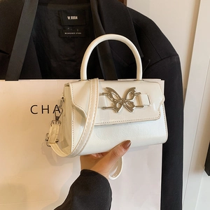 White glossy leather handbag with silver butterfly buckle and versatile crossbody strap