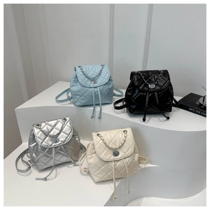 Quilted mini backpacks in four colors with metal chain straps and twist-lock closures