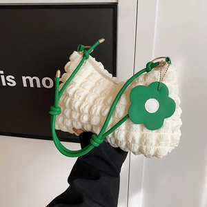 White bubble textured hobo bag with green strap and daisy charm for women