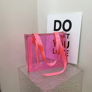 Minimalist pink transparent PVC tote bag with durable nylon handles and reinforced edges