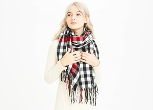 Detailed view of soft buffalo plaid scarf with fringes and red-black-white checkered pattern