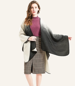 Detail of black and white gradient knit shawl with fine whipstitch edges for women