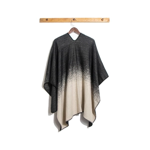 Close-up of thick knit gradient shawl with decorative whipstitch edging details