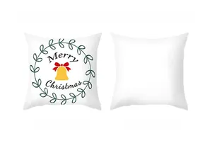 Detail of Christmas wreath cushion cover with Merry Christmas print and plain white reverse