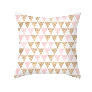 Macro detail of geometric pink and gold glitter triangle print on peach skin pillowcase