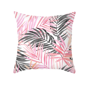Detail view of pink peach skin pillowcase featuring watercolor tropical palm leaf prints