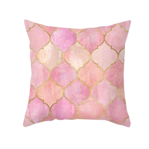 Detailed texture of pink peach skin pillowcase with golden quatrefoil geometric patterns