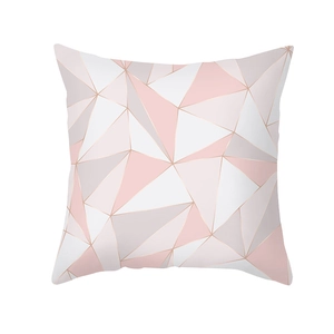 Detail of pink and grey geometric triangle pattern on soft peach skin pillowcase