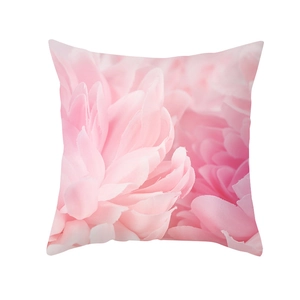 Macro detail of peach skin pillowcase featuring large pink floral print on white base