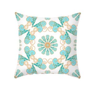 Close-up of geometric mandala pattern on blue and orange peach skin pillowcase