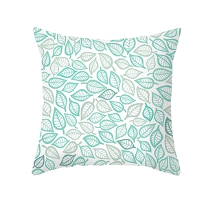 Detailed pattern of green leaf prints on a minimalist peach skin fabric cushion cover
