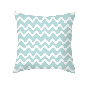 Detail of blue and white geometric wave pattern on a square peach skin pillowcase