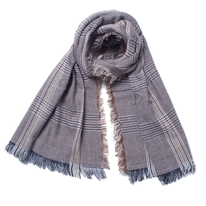 Detail of coffee and gray plaid scarf with natural fringe edges and soft texture