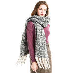 Thick black and white knit shawl scarf with long tassels for autumn and winter outfits