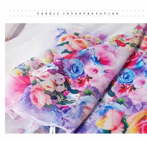 Detail of thin chiffon fabric with colorful rose prints and fine mechanical lockstitch edges