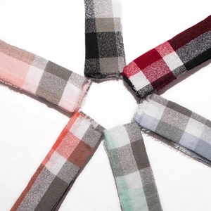 Set of six large plaid scarves in multiple colors displayed in a radial layout
