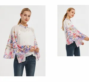 Detail of summer button sun protection cardigan with floral print on light chiffon fabric