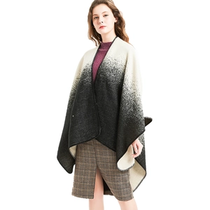 Women's gradient black and white knit shawl cape with elegant overlock edge detail