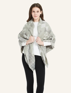Detail of gray geometric pattern cashmere-like scarf with fringe tassel edges